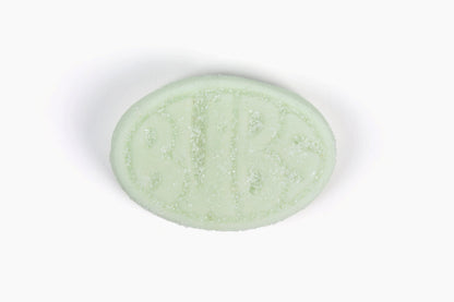 Swedish Candy Club, BUBS Fruity Pear Minis, light green oval candy with embossed BUBS logo and sugar coating.