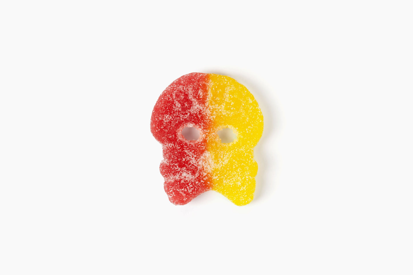 Swedish Candy Club BUBS Big Sour Skulls gummy candy, red and yellow with sugar coating.