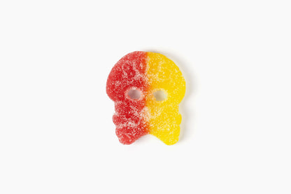 Swedish Candy Club BUBS Big Sour Skulls gummy candy, red and yellow with sugar coating.